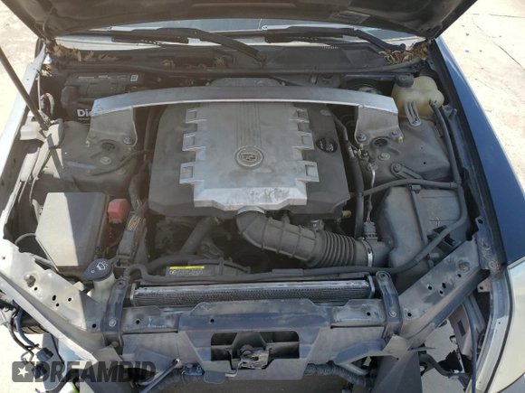 2008 Cadillac STS RWD z VIN 1G6DK67V980143995, wystawiony jako Copart lot #56365325 z przebiegiem 128 787 mil mil oraz Szkoda całkowita • Salvage title. Historia ofert i sprzedaży dostępna na DreamBid. Obrazek 11.