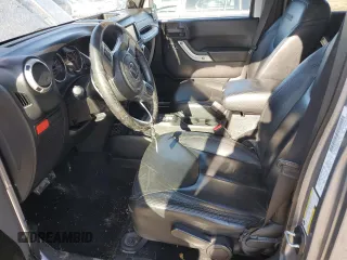 2013 Jeep Wrangler Unlimited Rubicon 10th Anniversary z VIN 1C4HJWFG3DL692993, wystawiony jako Copart lot #78599224 z przebiegiem 135 942 mil mil oraz Szkoda całkowita • Salvage title. Historia ofert i sprzedaży dostępna na DreamBid. Obrazek 7.