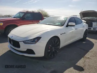2014 Maserati Ghibli z VIN ZAM57XSA3E1107153, wystawiony jako Copart lot #52210265 z przebiegiem 72 641 mil mil oraz Szkody całkowita. Historia ofert i sprzedaży dostępna na DreamBid. Obrazek 1.