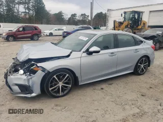 2022 Honda Civic Touring z VIN 2HGFE1F9XNH303203, wystawiony jako Copart lot #51415775 z przebiegiem 51 384 mil mil oraz Szkoda całkowita • Salvage title. Historia ofert i sprzedaży dostępna na DreamBid. Obrazek 1.