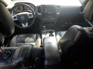 2013 Dodge Durango Crew z VIN 1C4RDHDG3DC700276, wystawiony jako Copart lot #52290215 z przebiegiem 198 243 mil mil oraz Szkody całkowita. Historia ofert i sprzedaży dostępna na DreamBid. Obrazek 8.