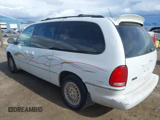 1997 Chrysler Town & Country with VIN 1C4GT64L7VB436658, listed as a IAAI auction lot 41823587 with 184,570 mi miles and . Bid and sale history available at DreamBid. Image 3.