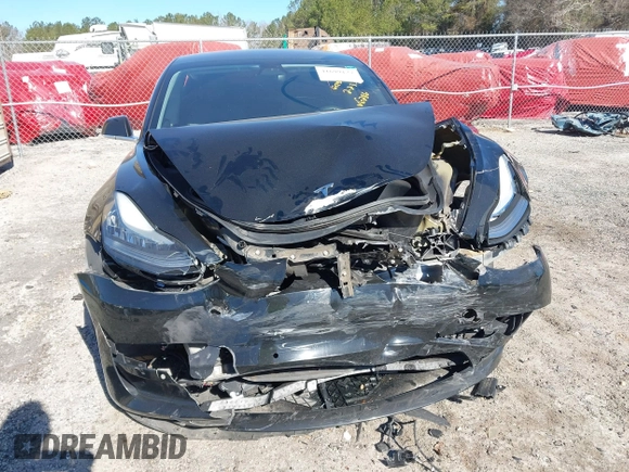 2019 Tesla Model 3 Mid Range with VIN 5YJ3E1EA2KF306286, listed as a IAAI auction lot 41699127 with 56,249 mi miles and . Bid and sale history available at DreamBid. Image 6.
