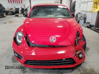 2015 Volkswagen Beetle with VIN 3VW7S7AT1FM822318, listed as a Copart auction lot 71398644 with 73,421 mi miles and Salvage Title. Bid and sale history available at DreamBid. Image 5.