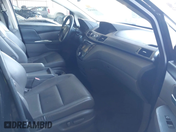 2014 Honda Odyssey Touring with VIN 5FNRL5H94EB110590, listed as a IAAI auction lot 42092929 with 242,338 mi miles and . Bid and sale history available at DreamBid. Image 5.