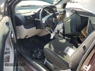 2013 Scion iQ with VIN JTNJJXB05DJ022305, listed as a Copart auction lot 58787155 with 136,046 mi miles and Salvage title. Bid and sale history available at DreamBid. Image 8.