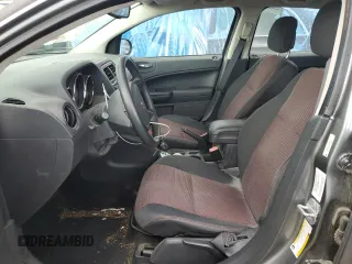 2011 Dodge Caliber Heat z VIN 1B3CB5HA4BD222393, wystawiony jako Copart lot #52901255 z przebiegiem 108 070 mil mil oraz Szkody całkowita. Historia ofert i sprzedaży dostępna na DreamBid. Obrazek 7.