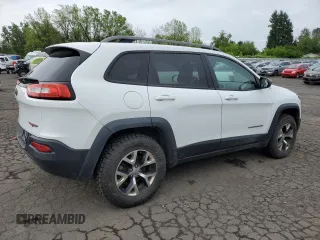 2014 Jeep Cherokee Trailhawk with VIN 1C4PJMBS8EW156633, listed as a Copart auction lot 58197675 with 133,029 mi miles and Clean title. Bid and sale history available at DreamBid. Image 3.