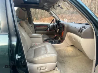 2000 Lexus LX 470 z VIN JT6HT00W5Y0105585, wystawiony jako Copart lot #49099395 z przebiegiem 153 695 mil mil oraz Czysty tytuł • Clean title. Historia ofert i sprzedaży dostępna na DreamBid. Obrazek 5.