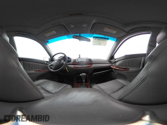 2003 Toyota Camry LE with VIN 4T1BE30K13U144114, listed as a IAAI auction lot 41829879 with 60,385 mi miles and . Bid and sale history available at DreamBid. Image 18.