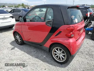 2009 Smart fortwo Pure z VIN WMEEJ31X89K291074, wystawiony jako Copart lot #56897635 z przebiegiem 145 504 mil mil oraz Tytuł czysty. Historia ofert i sprzedaży dostępna na DreamBid. Obrazek 2.