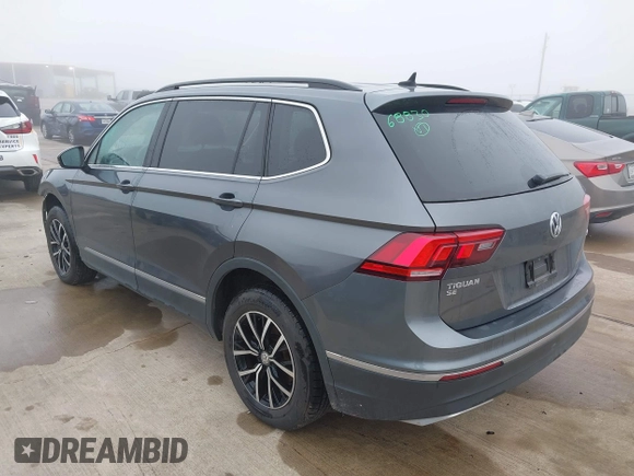 2021 Volkswagen Tiguan SE with VIN 3VV2B7AX8MM143189, listed as a IAAI auction lot 41646843 with 56,672 mi miles and . Bid and sale history available at DreamBid. Image 3.