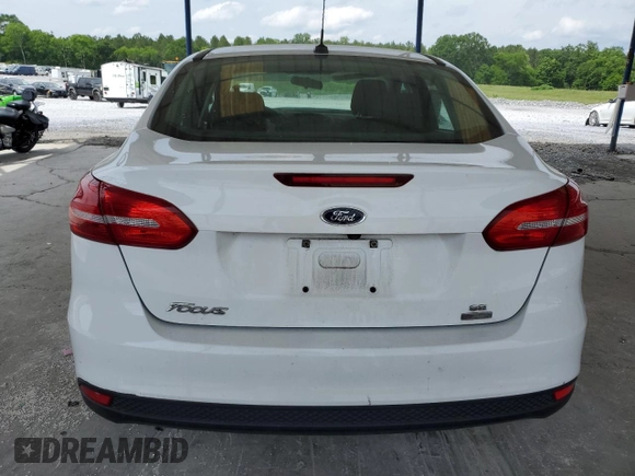 2018 Ford Focus SE с VIN 1FADP3FE5JL329350, выставлен на аукционе Copart как лот 57339055 с пробегом 61 391 миль миль и Списание • Salvage title. История ставок и продаж доступна на DreamBid. Изображение 6.