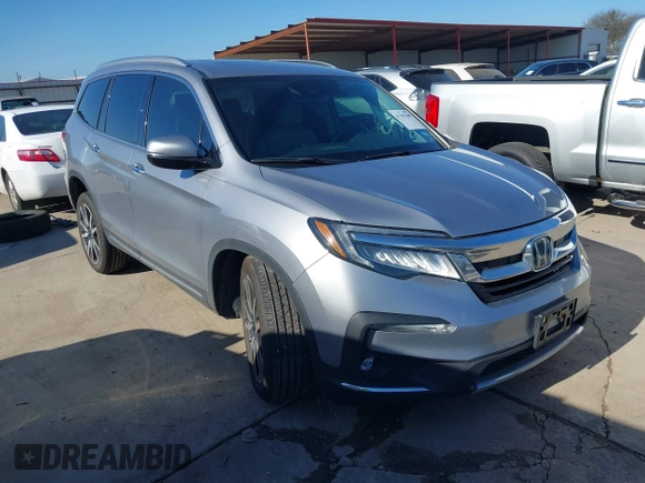 2020 Honda Pilot Touring 8-Passenger with VIN 5FNYF6H95LB021455, listed as a IAAI auction lot 41187609 with 35,589 mi miles and . Bid and sale history available at DreamBid. Image 1.