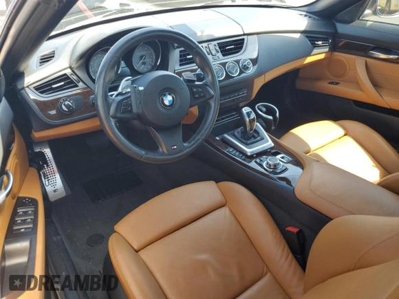 2011 BMW Z4 sDrive35is with VIN WBALM1C56BE393858, listed as a Copart auction lot 74249954 with Not provided miles and Salvage title. Bid and sale history available at DreamBid. Image 8.