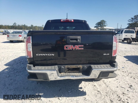 2015 GMC Canyon 2WD SLE with VIN 1GTG5BEA6F1221120, listed as a Copart auction lot 77391484 with 180,334 mi miles and Salvage Title. Bid and sale history available at carsss.com. Image 6.
