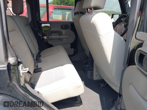 2008 Jeep Wrangler Unlimited Sahara with VIN 1J4GA59128L608515, listed as a IAAI auction lot 42627584 with 157,821 mi miles and . Bid and sale history available at DreamBid. Image 8.