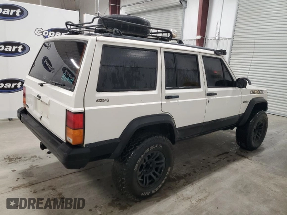 1996 Jeep Cherokee Sport with VIN 1J4FJ68S5TL235927, listed as a Copart auction lot 68942174 with 238,619 mi miles and Clean Title. Bid and sale history available at carsss.com. Image 3.