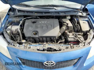 2010 Toyota Corolla z VIN 1NXBU4EE0AZ174665, wystawiony jako Copart lot #52187365 z przebiegiem 121 769 mil mil oraz Szkoda całkowita • Salvage title. Historia ofert i sprzedaży dostępna na DreamBid. Obrazek 11.
