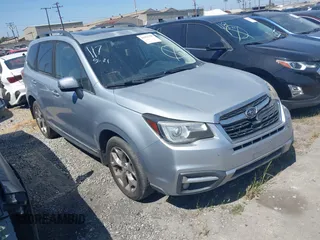 2017 Subaru Forester Touring z VIN JF2SJAWCXHH427424, wystawiony jako IAAI lot #41953758 z przebiegiem 214 263 mil mil oraz . Historia ofert i sprzedaży dostępna na DreamBid. Obrazek 1.