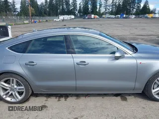 2014 Audi A7 Premium Plus z VIN WAUWGAFC4EN160144, wystawiony jako IAAI lot #41970181 z przebiegiem 118 761 mil mil oraz . Historia ofert i sprzedaży dostępna na DreamBid. Obrazek 13.