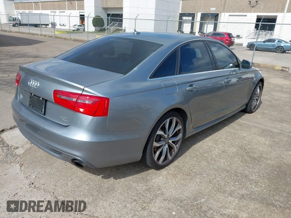 2013 Audi A6 3.0T Prestige with VIN WAUHGAFC4DN126258, listed as a IAAI auction lot 41512291 with 123,298 mi miles. Bid and sale history available at carsss.com. Image 4.