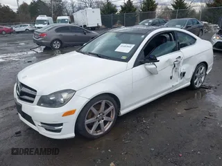 2015 Mercedes-Benz C-Class C 250 with VIN WDDGJ4HB6FG401261, listed as a IAAI auction lot 41483848 with 124,915 mi miles. Bid and sale history available at carsss.com. Image 2.