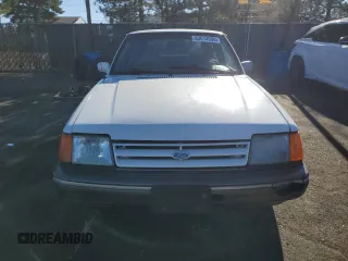 1989 Ford Escort z VIN 1FAPP9090KW279114, wystawiony jako Copart lot #83614994 z przebiegiem 60 585 mil mil oraz Nie do naprawy. Historia ofert i sprzedaży dostępna na DreamBid. Obrazek 5.