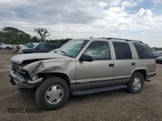 1999 GMC Yukon with VIN 1GKEK13R9XJ787877, listed as a Copart auction lot 72185044 with 191,710 mi miles and Salvage Title. Bid and sale history available at carsss.com. Image 1.