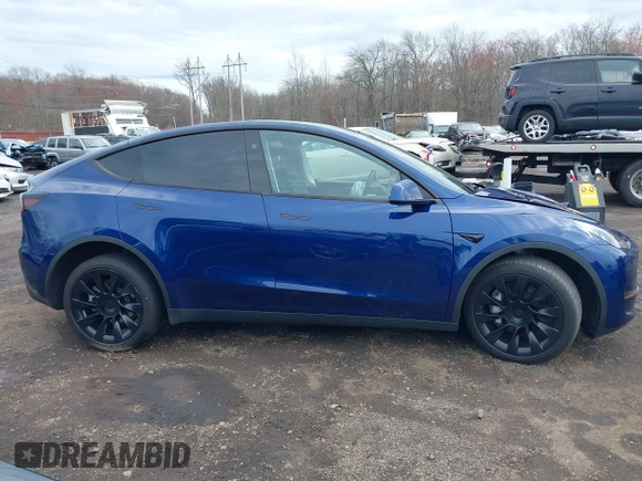 2023 Tesla Model Y Long Range with VIN 7SAYGDEE4PF891709, listed as a IAAI auction lot 41944893 with 15,864 mi miles. Bid and sale history available at carsss.com. Image 13.