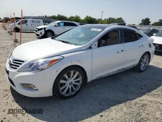 2013 Hyundai Azera z VIN KMHFH4JG9DA209562, wystawiony jako Copart lot #59808655 z przebiegiem 130 994 mil mil oraz Szkoda całkowita • Salvage title. Historia ofert i sprzedaży dostępna na DreamBid. Obrazek 1.
