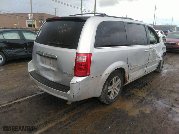2010 Dodge Grand Caravan SXT with VIN 2D4RN5DX1AR127914, listed as a IAAI auction lot 41720511 with 169,953 mi miles. Bid and sale history available at carsss.com. Image 4.