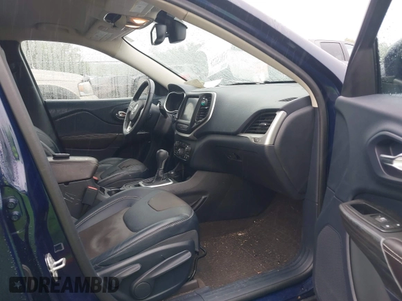 2014 Jeep Cherokee Limited with VIN 1C4PJMDS0EW277301, listed as a IAAI auction lot 42357034 with 61,825 mi miles and . Bid and sale history available at DreamBid. Image 5.