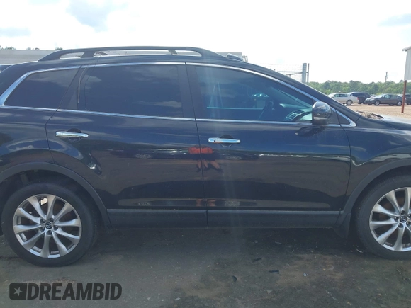 2015 Mazda CX-9 Grand Touring with VIN JM3TB2DA4F0464186, listed as a IAAI auction lot 42227595 with 124,526 mi miles and . Bid and sale history available at DreamBid. Image 13.