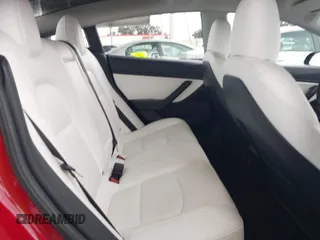 2021 Tesla Model 3 Long Range with VIN 5YJ3E1EB3MF862392, listed as a IAAI auction lot 41765987 with 51,915 mi miles and . Bid and sale history available at DreamBid. Image 8.