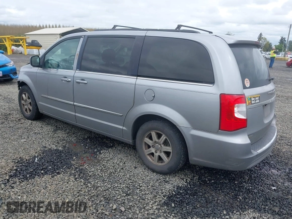 2013 Chrysler Town & Country Touring with VIN 2C4RC1BG2DR656629, listed as a IAAI auction lot 42024459 with 209,472 mi miles and . Bid and sale history available at DreamBid. Image 3.