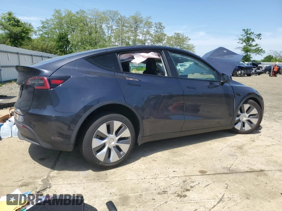 2024 Tesla Model Y with VIN 7SAYGDED6RF091715, listed as a Copart auction lot 56535585 with 23,120 mi miles and Salvage title. Bid and sale history available at DreamBid. Image 3.