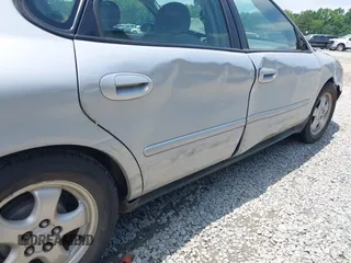 2006 Ford Taurus SE z VIN 1FAFP53UX6A105350, wystawiony jako IAAI lot #42363631 z przebiegiem 107 825 mil mil oraz . Historia ofert i sprzedaży dostępna na DreamBid. Obrazek 6.