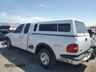 1999 Ford F-150 XL with VIN 1FTZX0726XKA98752, listed as a Copart auction lot 58986695 with Not provided miles and Salvage title. Bid and sale history available at DreamBid. Image 2.