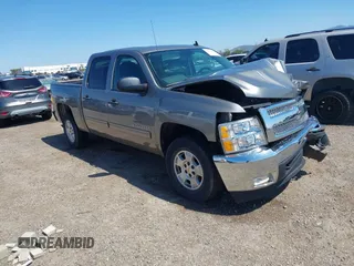 2013 Chevrolet Silverado 1500 LT with VIN 3GCPKSE70DG276707, listed as a IAAI auction lot 41831822 with 127,307 mi miles and . Bid and sale history available at DreamBid. Image 1.
