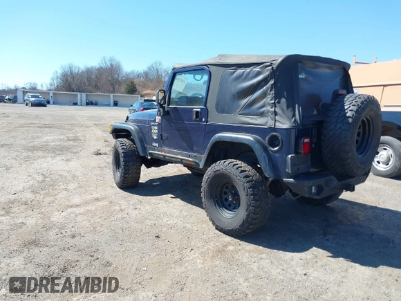 2003 Jeep Wrangler Sport with VIN 1J4FA49S03P343285, listed as a IAAI auction lot 41823684 with 201,723 mi miles and . Bid and sale history available at DreamBid. Image 3.