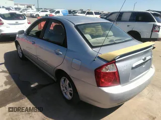 2005 Kia Spectra LX with VIN KNAFE121055121500, listed as a IAAI auction lot 39677018 with 142,307 mi miles. Bid and sale history available at carsss.com. Image 3.