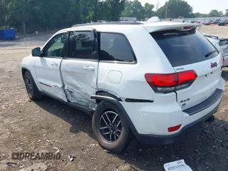 2021 Jeep Grand Cherokee Trailhawk with VIN 1C4RJFLG5MC564912, listed as a IAAI auction lot 42589787 with 25,604 mi miles and . Bid and sale history available at DreamBid. Image 3.