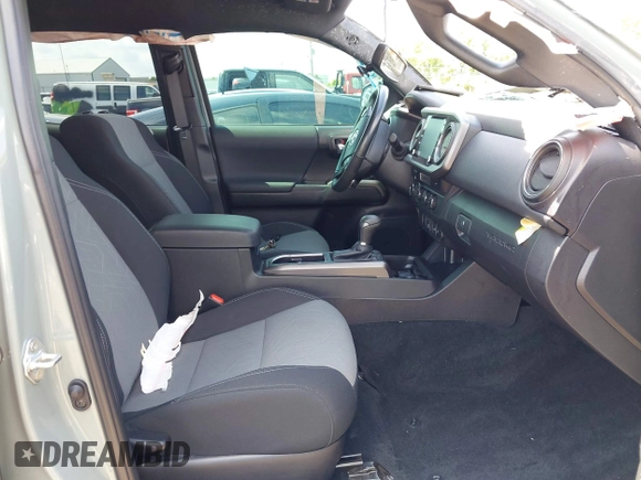 2023 Toyota Tacoma SR with VIN 3TMCZ5AN1PM581266, listed as a IAAI auction lot 42371395 with 32,582 mi miles and . Bid and sale history available at DreamBid. Image 5.