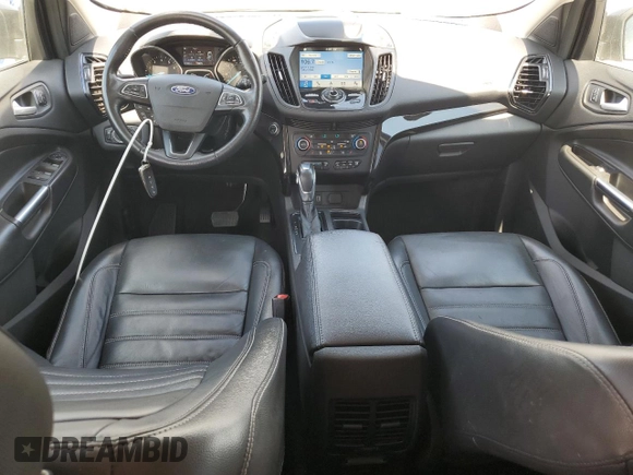 2019 Ford Escape Titanium z VIN 1FMCU9J96KUA65154, wystawiony jako Copart lot #63932325 z przebiegiem 117 963 mil mil oraz Czysty tytuł • Clean title. Historia ofert i sprzedaży dostępna na DreamBid. Obrazek 8.