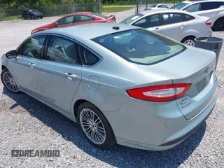 2013 Ford Fusion SE Hybrid z VIN 3FA6P0LU4DR259073, wystawiony jako IAAI lot #42197143 z przebiegiem 87 337 mil mil oraz . Historia ofert i sprzedaży dostępna na DreamBid. Obrazek 3.