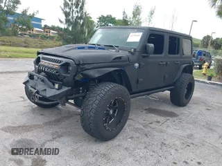 2018 Jeep Wrangler Unlimited Sport S z VIN 1C4HJXDG2JW228483, wystawiony jako IAAI lot #41710364 z przebiegiem 56 970 mil mil oraz . Historia ofert i sprzedaży dostępna na DreamBid. Obrazek 2.