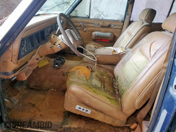 1986 Jeep Grand Wagoneer с VIN 1JCNJ15U5GT147524, выставлен на аукционе Copart как лот 57421255 с пробегом 112 292 миль миль и Списание • Salvage title. История ставок и продаж доступна на DreamBid. Изображение 7.