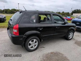 2005 Hyundai Tucson GL with VIN KM8JM12BX5U071182, listed as a Copart auction lot 74852974 with 74,235 mi miles and Salvage Title. Bid and sale history available at carsss.com. Image 3.