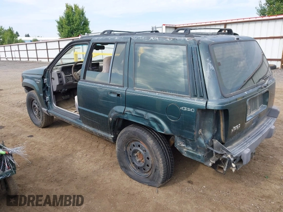 1994 Jeep Grand Cherokee Laredo with VIN 1J4GZ58S9RC215874, listed as a IAAI auction lot 42577378 with 230,824 mi miles and . Bid and sale history available at DreamBid. Image 3.